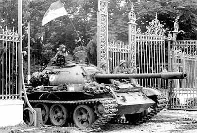 A North Vietnamese tank crashes through the gates of the Presidential Palace in Saigon on April 30, 1975. The taking of the palace marked the fall of the U.S.-backed south and the end to a decade of fighting.